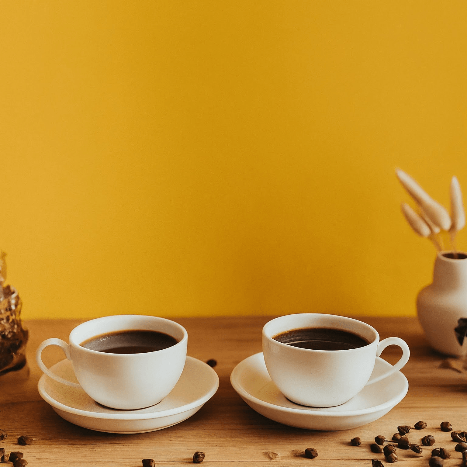 AI Design for two cups of coffee on table with yellow background, cozy home atmosphere with space for text in the middle
