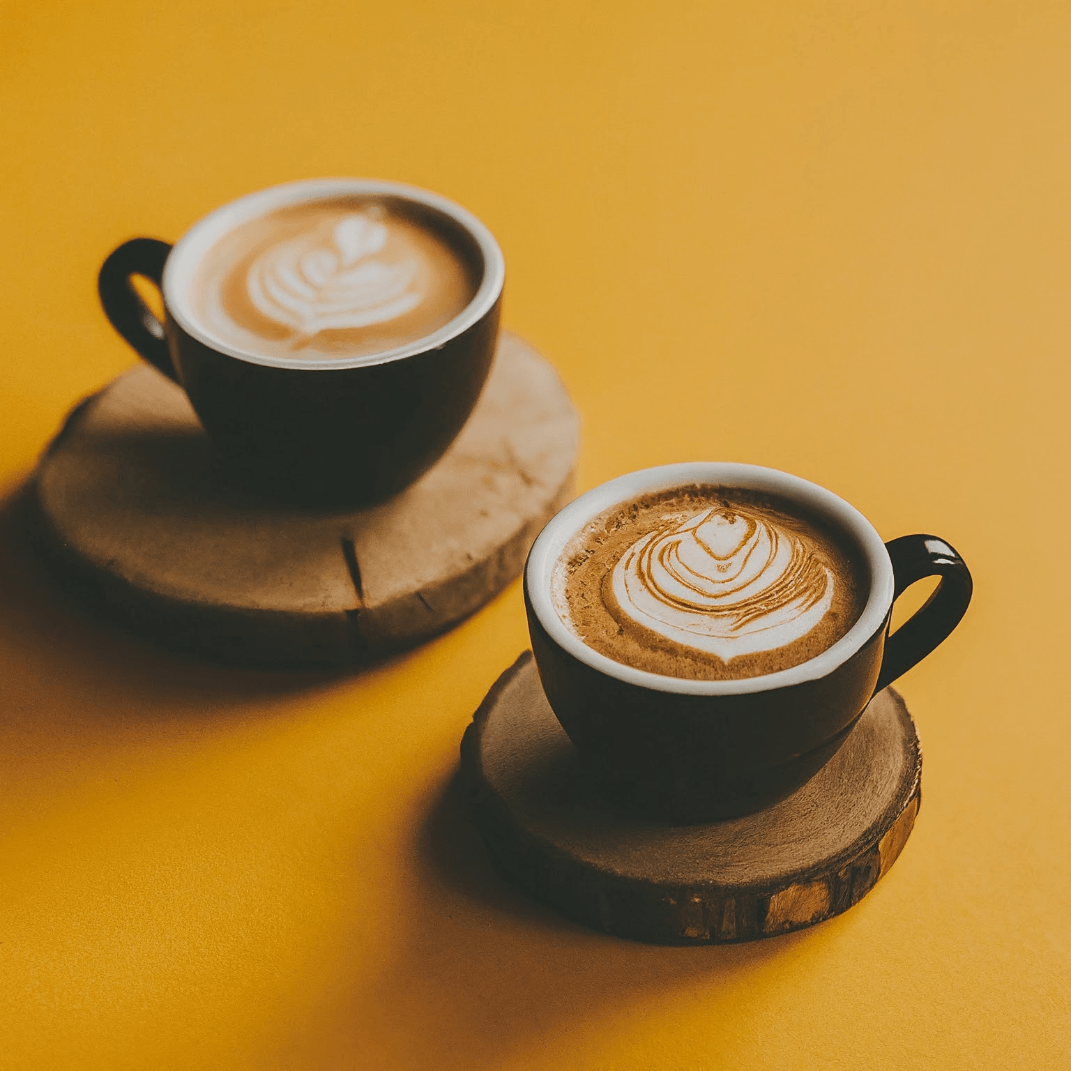 AI Design for Two cups of coffee, cozy home atmosphere, yellow background, for logo
