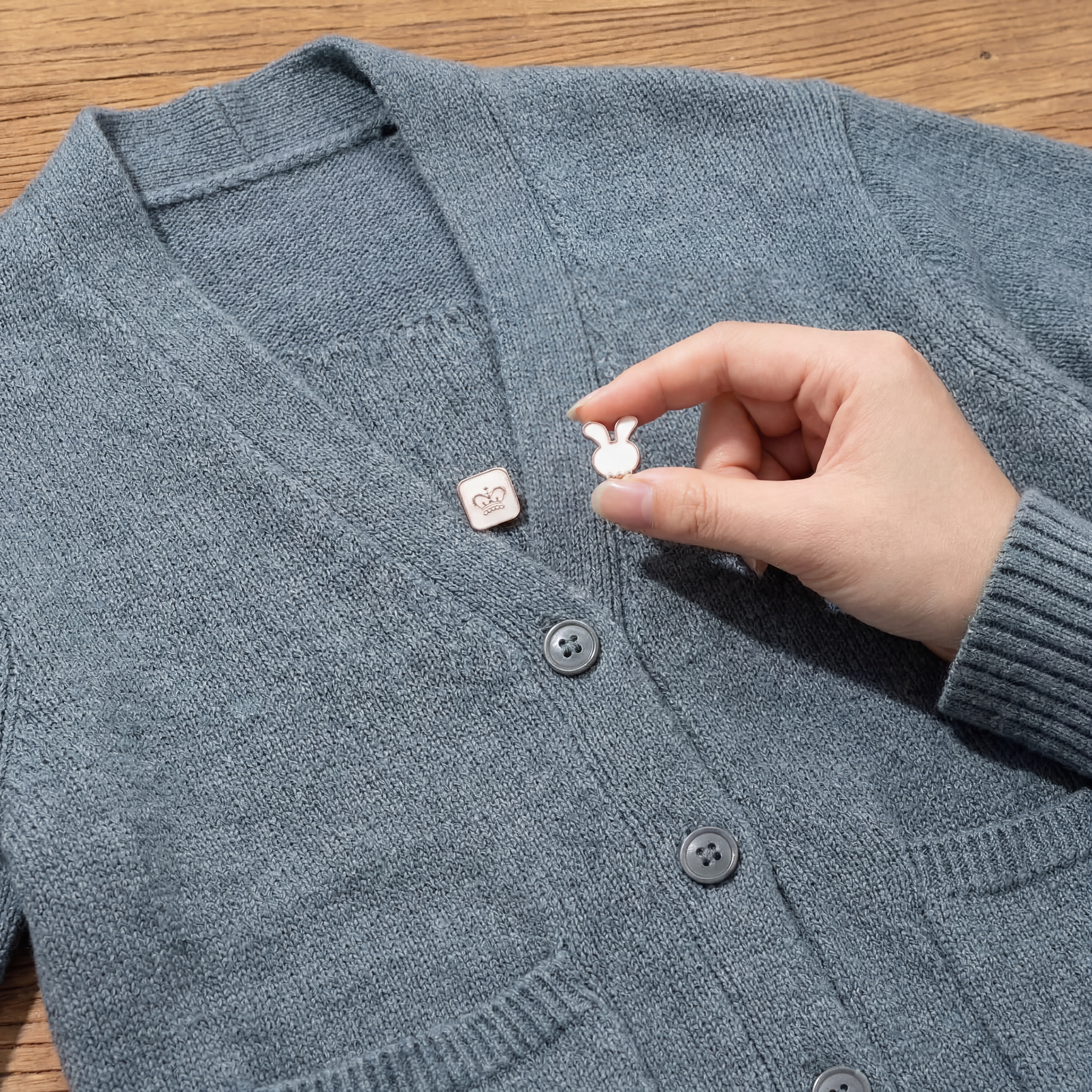 AI Design for GIVE ME A FULL SIZE IMAGE THAT ALSO SHOW WHOLE SWEETER SO THAT VIEWER CAN IMAGINE THE SIZE OF THE BROOCH