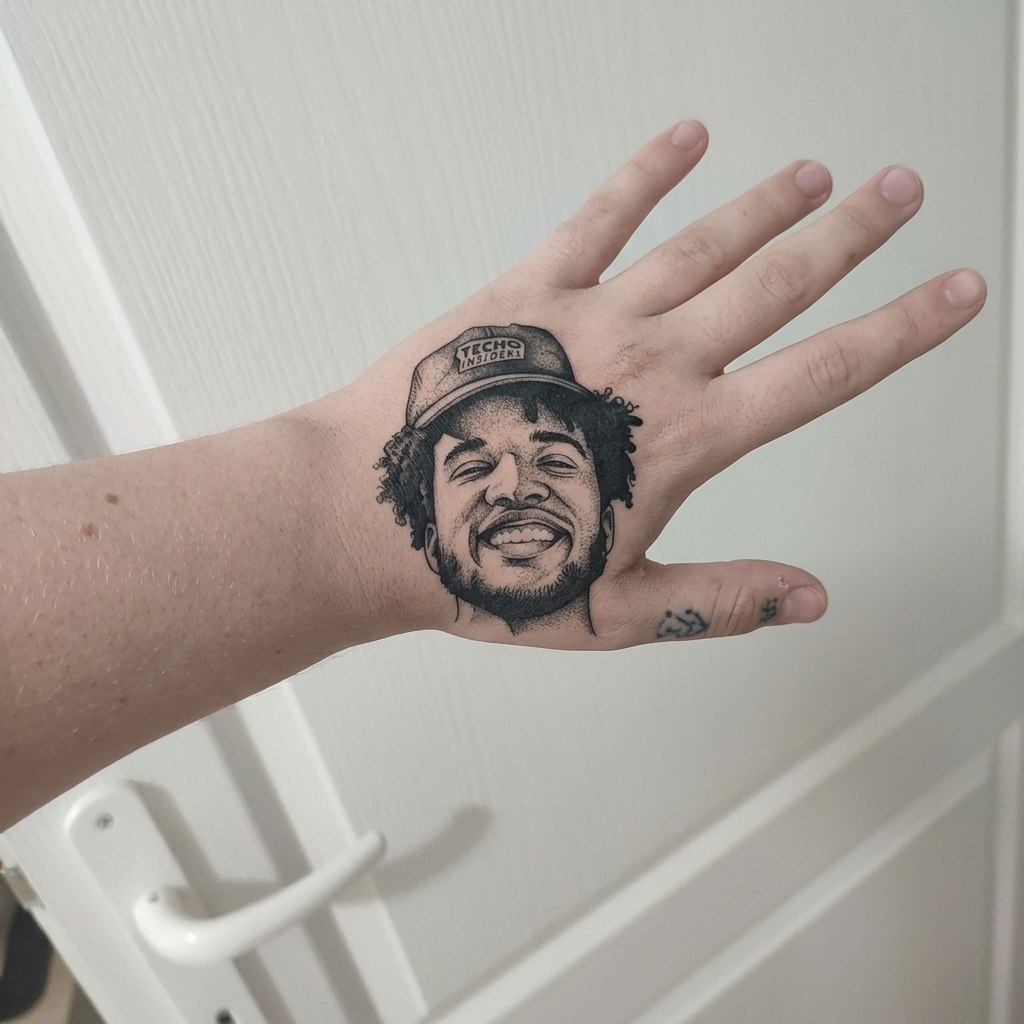 AI Design for Put a tattoo on my hand that looks like this person in fully black ink no color