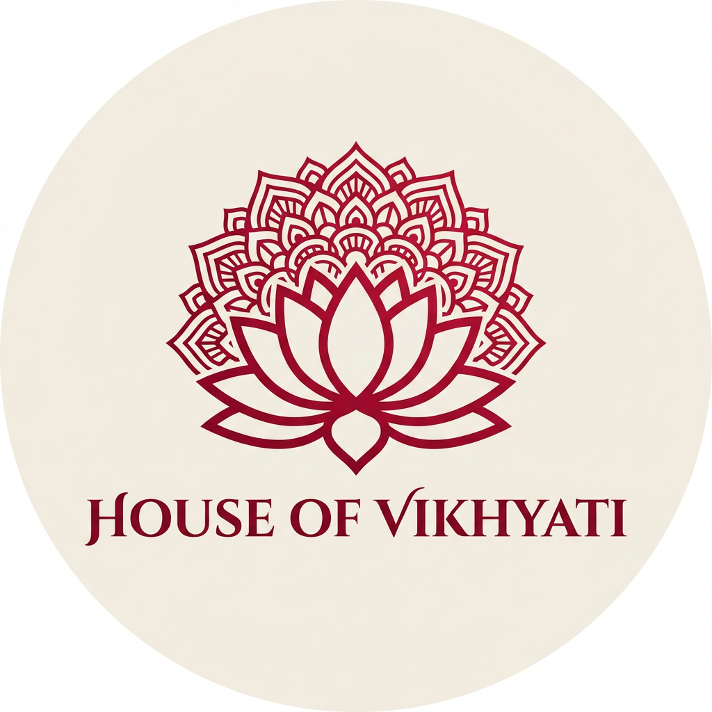 AI Design for A sophisticated, minimalist emblem logo for a brand named 'House of Vikhyati', featuring an elegant fusion of traditional Indian aesthetic and modern luxury. The design incorporates a stylized lotus motif or intricate mandala pattern rendered in a rich, deep crimson red against a clean, neutral background. The composition is balanced and symmetrical, designed specifically for high-impact clarity as an Instagram profile picture.