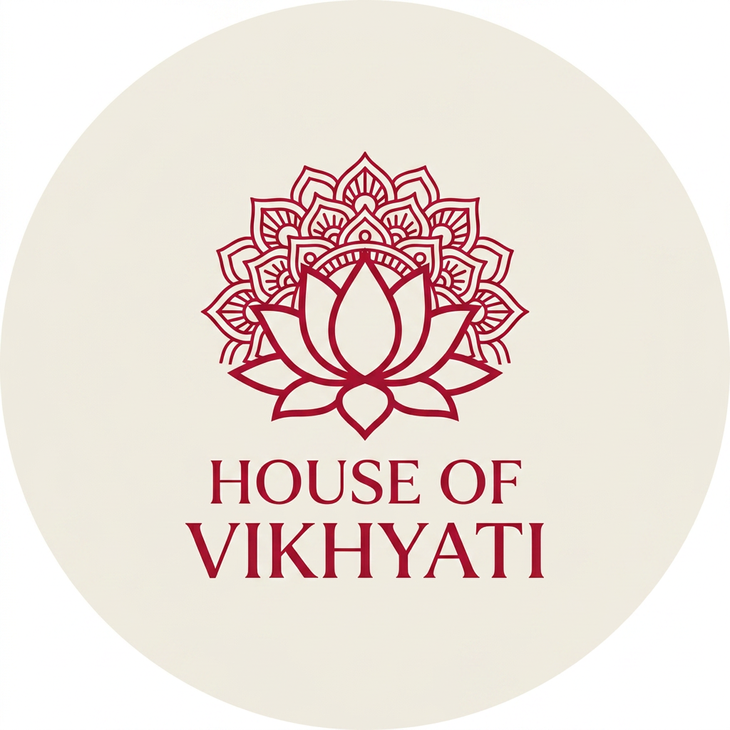 AI Design for A sophisticated, minimalist emblem logo for a brand named 'House of Vikhyati', featuring an elegant fusion of traditional Indian aesthetic and modern luxury. The design incorporates a stylized lotus motif or intricate mandala pattern rendered in a rich, deep crimson red against a clean, neutral background. The composition is balanced and symmetrical, designed specifically for high-impact clarity as an Instagram profile picture.