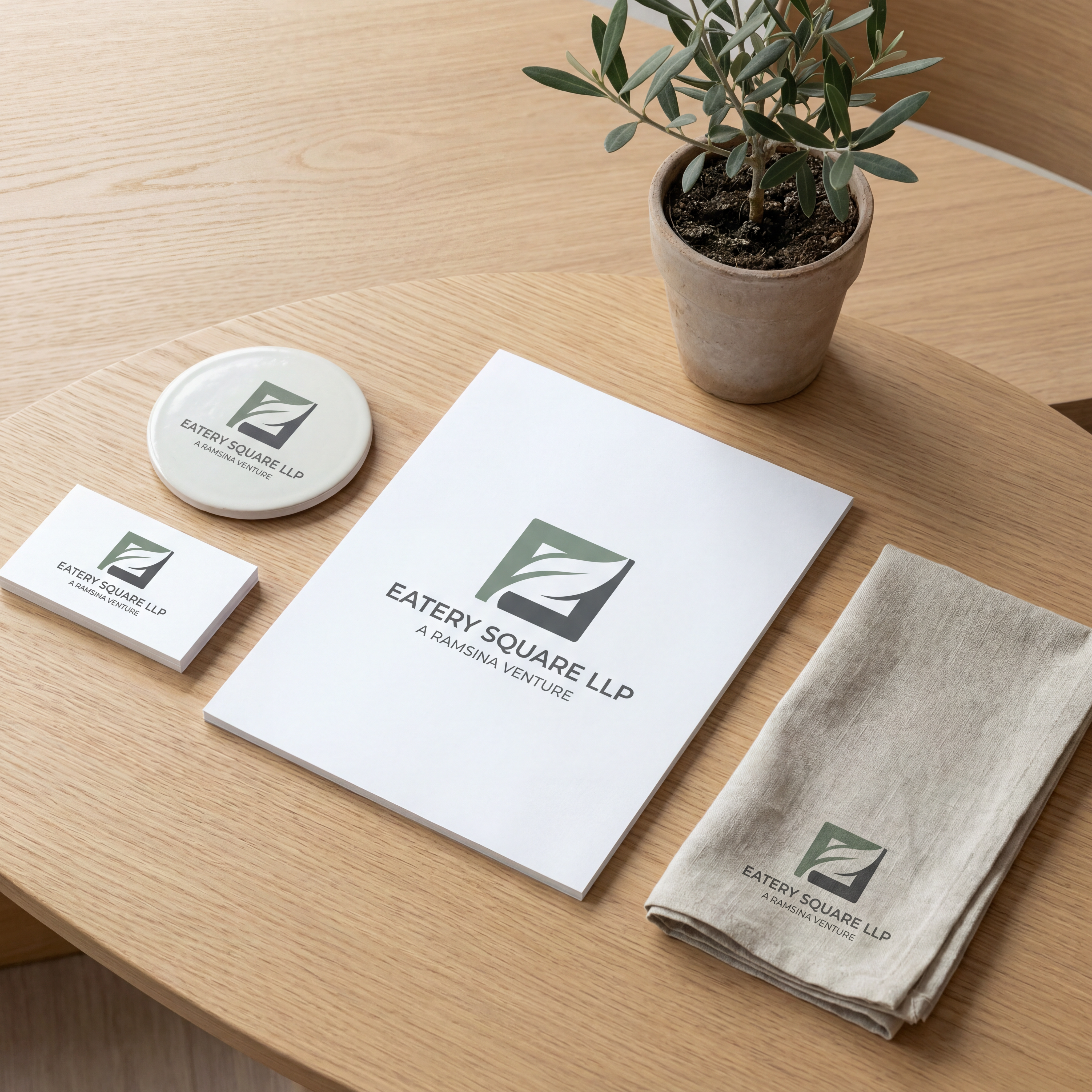 AI Design for we need a logo and brand identity for our new sister company, Eatery Square LLP.

Eatery Square LLP is a hospitality venture under Ramsina and will include hotels, food malls, spas and other hospitality experiences.

Requirement:

Minimal and sophisticated logo
Subtle incorporation/inspiration of leaf 
Should be versatile