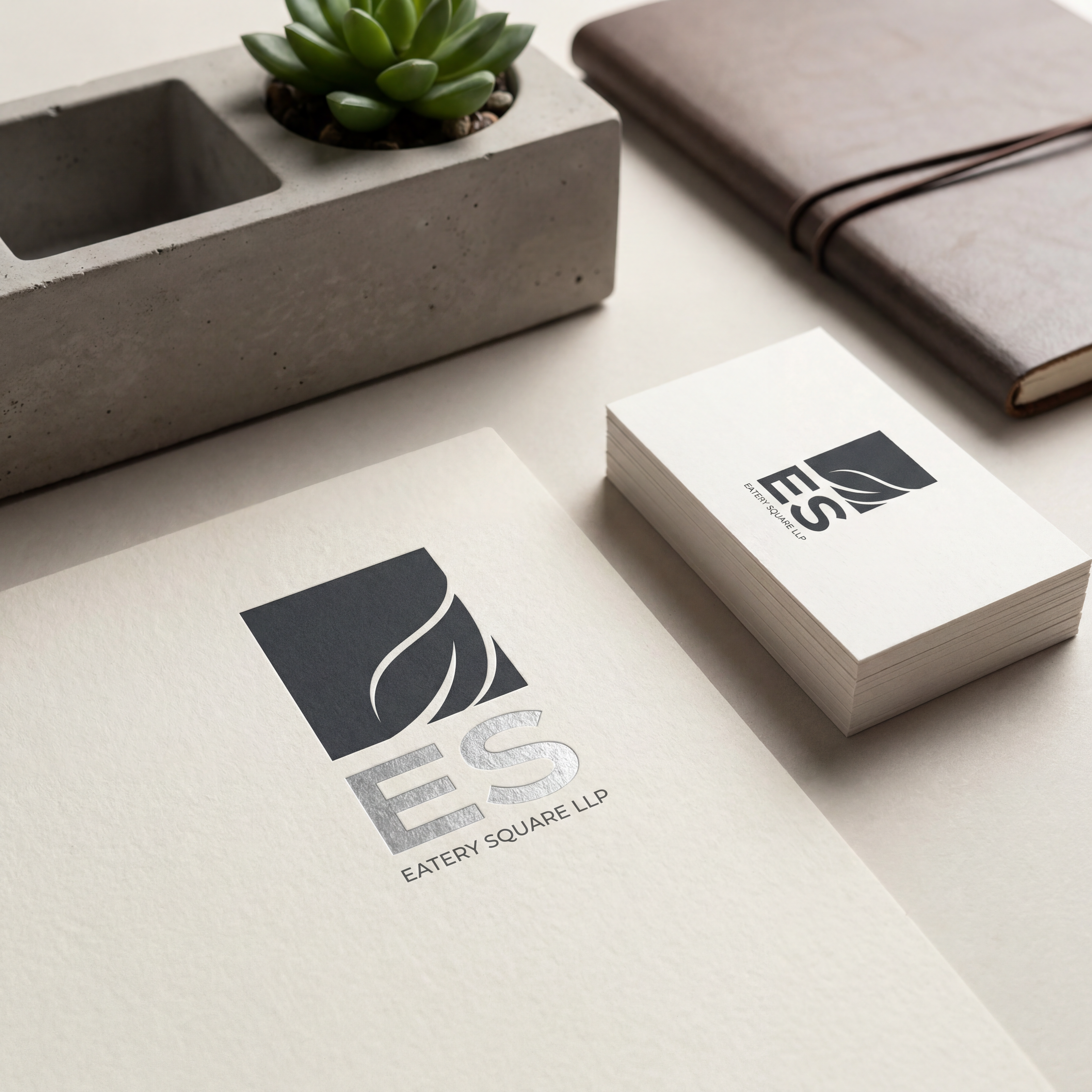 AI Design for we need a logo and brand identity for our new sister company, Eatery Square LLP.
Eatery Square LLP is a hospitality venture under Ramsina and will include hotels, food malls, spas and other hospitality experiences.
Requirement:
VERY Minimal and sophisticated logo
Subtle incorporation/inspiration of leaf
Should be versatile