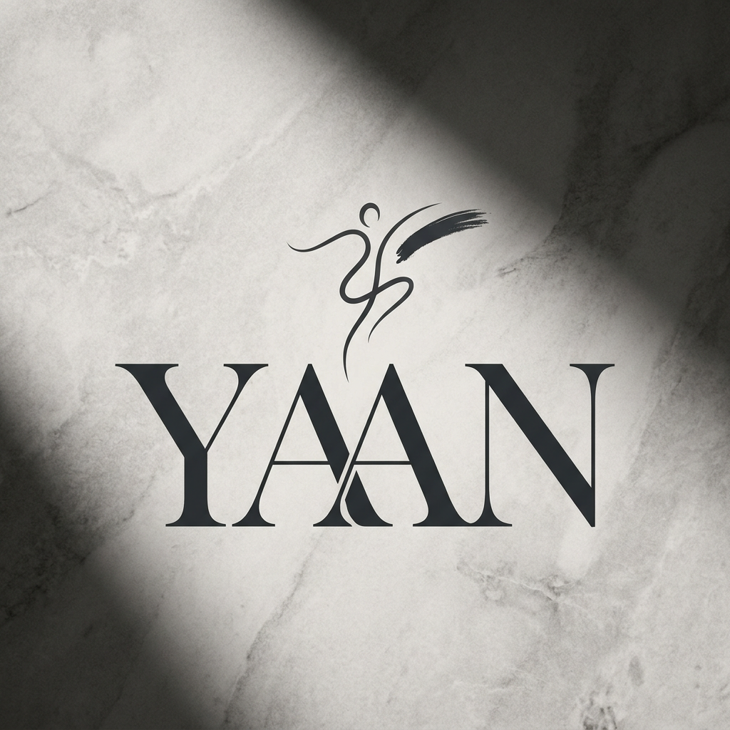 AI Design for A sophisticated and minimalist luxury logo for a high-end clothing brand named YAAN, featuring elegant, clean typography with high-contrast serif lettering. The design should feel timeless and premium, incorporating a subtle, abstract icon that represents the concept of self-expression, set against a monochromatic textured background with soft, dramatic studio lighting.