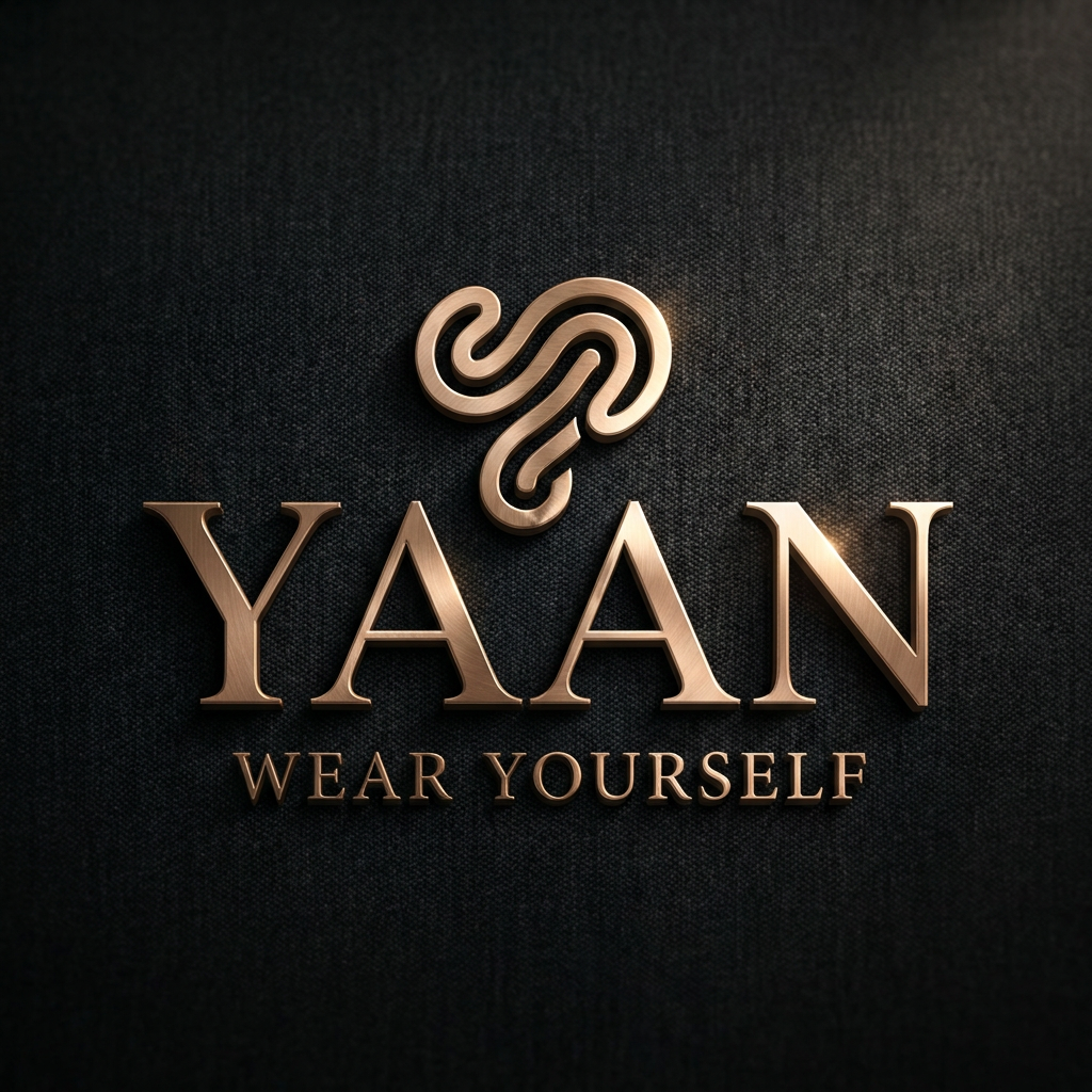 AI Design for A sophisticated, high-end minimalist logo for the brand YAAN, featuring refined high-contrast serif typography and a subtle, abstract icon representing self-expression. The logo is presented with a premium metallic finish against a deep charcoal monochromatic background with subtle fabric-like texture, illuminated by dramatic studio lighting that creates elegant highlights and soft shadows to emphasize luxury craftsmanship. TAGLINAE WEAR YOURSELF