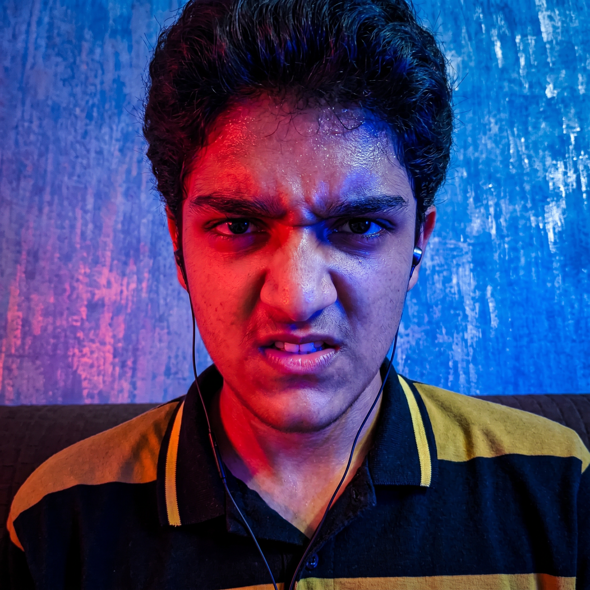 AI Design for convert into the anger face and red and blue lighting effects and convert into in the realistic photo
