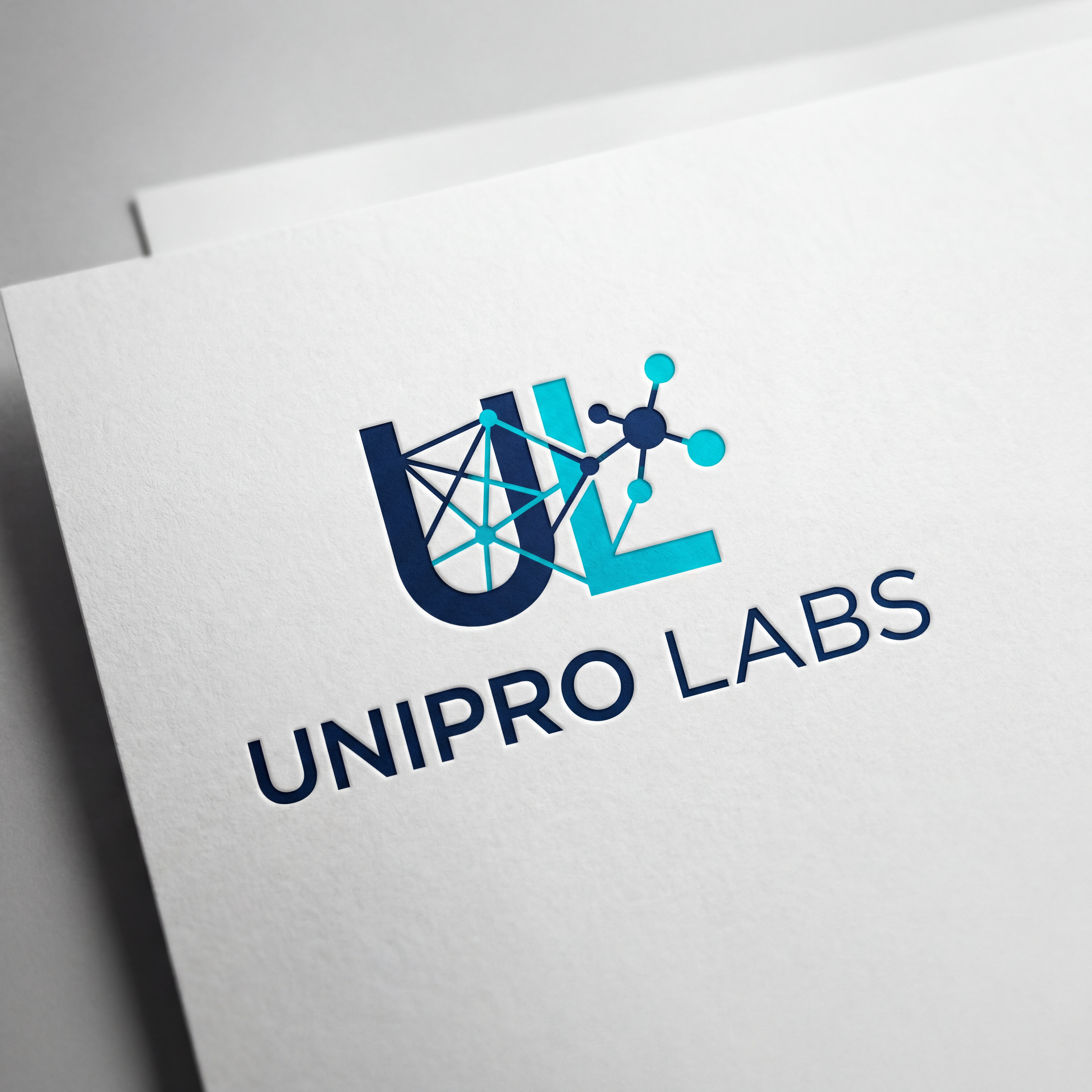 AI Design for A professional, minimalist logo design for UNIPRO LABS, featuring a clean geometric icon that symbolizes scientific innovation and connectivity. The design utilizes a modern sans-serif typography, a sophisticated color palette of deep navy blue and vibrant cyan, and is presented on a crisp white background with subtle studio lighting to emphasize a premium, high-tech aesthetic.