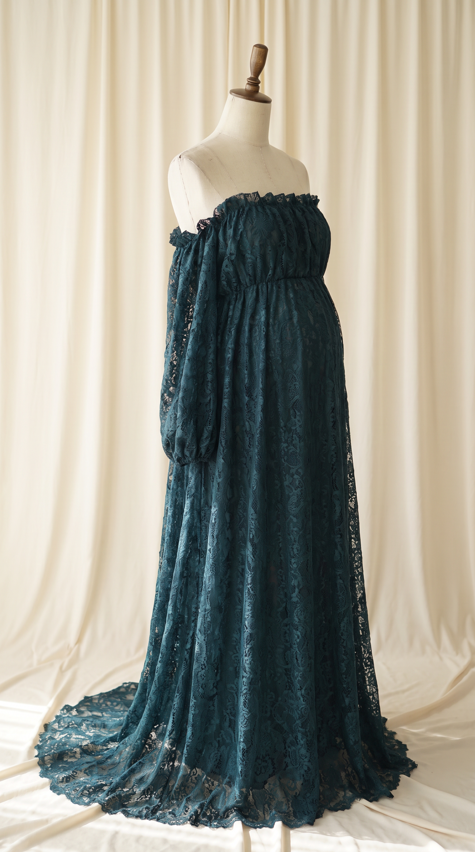 AI Design for 

{
  "task": "Reference-guided maternity garment transfer and studio background replacement",
  "reference_image": "[Attach the original maternity dress photograph]",
  "prompt": "Create a photorealistic maternity fashion product photograph using the attached image as the authoritative garment reference. Transfer the existing dress onto the specified pregnant tailor's dress form; do not create a similar dress, reinterpret the design, beautify it, or redesign it. Change only the original wearer or display form and the surrounding environment. Garment fidelity takes priority over styling and aesthetics. Follow the preservation, mannequin, background, lighting, and framing requirements below.",
  "garment_preservation": {
    "preserve": "Match the visible reference faithfully: hue, saturation, tonal relationships, fabric texture and weight, weave, sheen, transparency, print scale and placement, lace motifs, embroidery, embellishments, seams, neckline, bodice construction, waistline, sleeve cut and length, cuffs, hem, skirt volume, dress length, and any existing train.",
    "fit_and_drape": "Allow only the physically necessary changes in folds and tension caused by fitting the garment to the pregnant form. Preserve the garment's construction and overall silhouette. Fabric must respond naturally to gravity and belly volume, without stretching prints, melting lace, or distorting seams. Support the sleeves naturally without visible arms, hands, rods, or stuffing.",
    "uncertainty": "Do not invent decorative details or unseen garment construction. Keep the reference viewing angle where possible. If the hem or train is cropped out, preserve a comparable crop rather than inventing its appearance. Do not add a train if none is shown."
  },
  "mannequin": {
    "type": "Classic vintage tailor's dress form with a realistic pregnant torso and softly rounded belly, standing upright and centered.",
    "finish": "Matte cream-ivory linen-covered body, gently rounded shoulder ends, and a small round natural-wood neck cap. No head, facial features, arms, hands, human skin, glossy plastic, or exaggerated anatomy.",
    "visibility": "The dress remains the visual focus. Show the form only where the garment naturally exposes it; do not alter the neckline or opacity to hide it. Keep any support discreet and mostly concealed by the garment."
  },
  "background": "A plain warm off-white ivory fabric curtain with soft vertical folds and subtle vintage texture, clean and unpatterned. Matching ivory fabric continues onto the floor in gentle natural folds, creating visual continuity without a hard horizon line. No furniture, props, decorative architecture, or additional objects.",
  "lighting": "Large, soft, diffused daylight from slightly above and to one side; gentle fill, delicate contact shadows, and natural depth. Neutral white balance preserves garment color. Maintain separation between the dress and ivory backdrop without changing either color. No harsh shadows, clipped highlights, strong color casts, or artificial glow.",
  "composition": "Portrait framing, centered subject, straight verticals, realistic proportions, and minimal perspective distortion. Show the complete dress and existing train when supported by the reference, with modest breathing room. Preserve a cropped composition when required to avoid inventing missing garment details.",
  "output": {
    "aspect_ratio": "16:21",
    "orientation": "portrait",
    "style": "High-detail photorealistic product photography; crisp textile detail, natural tonal transitions, no CGI appearance."
  },
  "negative_prompt": "human model, head, face, hair, arms, hands, exposed human skin, non-pregnant torso, oversized belly, glossy plastic mannequin, redesigned dress, altered neckline, missing sleeves, added sleeves, changed hem, invented train, changed color, incorrect print scale, misplaced pattern, missing embellishments, added decorations, warped seams, melted lace, floating fabric, artificial transparency, clutter, furniture, luxury interior, text, logo, watermark, harsh flash, yellow color cast, oversaturation, blur, excessive smoothing, CGI, illustration"
}
