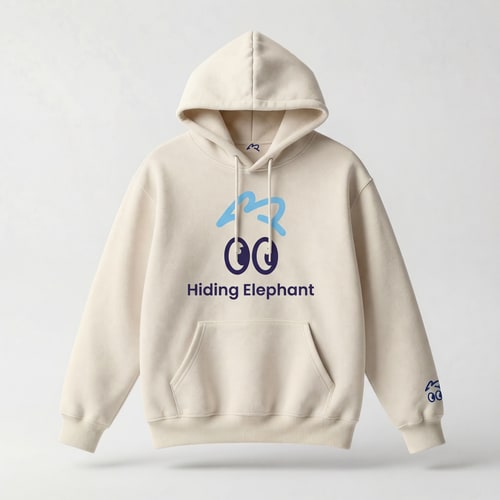 AI Design for Ultra realistic studio product photo of a beige oversized hoodie, front-facing, no model.
Premium cotton fabric, soft texture, natural folds, high-quality stitching,
fashion e-commerce style, clean and minimal.
Apply full “Hiding Elephant” branding to the hoodie:
— Main chest branding:
centered playful eye icon inspired by the Hiding Elephant logo,
rounded friendly cartoon eyes with a small eyebrow above,
printed in soft sky blue and deep navy.
— Brand name:
“Hiding Elephant” placed under the icon in clean modern sans-serif typography,
balanced spacing, subtle and confident.
— Secondary branding details:
small eye icon embroidered near the left sleeve cuff,
tiny eyebrow graphic on the back near the neck collar,
minimal and tasteful.
Branding style:
friendly, smart, playful but premium,
not childish, not loud, modern startup streetwear.
Printing style:
high-quality screen print and embroidery mix,
ink integrated naturally into fabric.
Lighting:
soft diffused studio light,
gentle shadows, realistic depth.
Background:
light neutral studio background (off-white / light gray),
no texture, no gradients.
Ultra realistic product mockup,
fashion brand presentation,
sharp focus, high detail, professional photography.