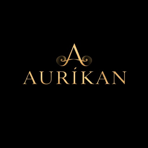 AI Design for Lettermark for a luxury, premium perfume brand named "AURÍKAN": A sophisticated and royal lettermark focusing on the brand name, emphasizing the accented "Í" with a subtle, integrated duality symbol. Use a minimal yet bold modern serif typography with a glossy finish. The design should evoke global premium fragrance house elegance (similar to Dior, Chanel, Tom Ford), with a symmetrical layout and clean, high-end fashion aesthetic. Visual execution will feature abstract smoke swirls subtly intertwined with a stylized monogram "A" or a balanced split design integrated into the typography. Color palette: black and gold or champagne gold on a dark background. Provide a high-resolution vector logo suitable for packaging and bottle labels, with a dark marble or gradient presentation background and a clean transparent version.