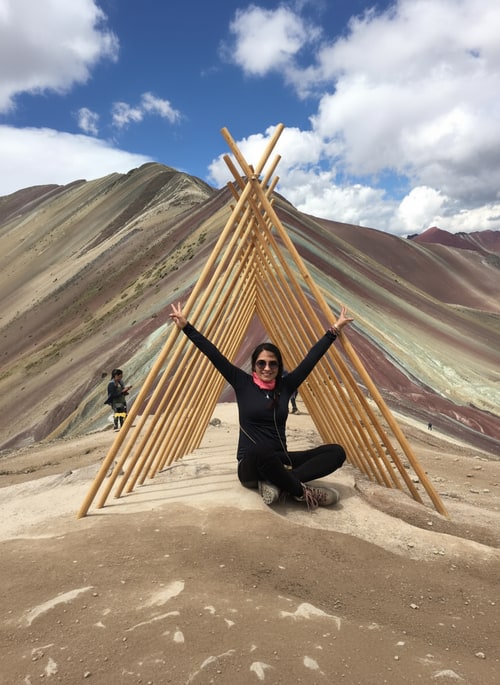 AI Design for Can you place the pavilion from the second image onto the first image so that the person is inside it? The person should be inside the pavilion