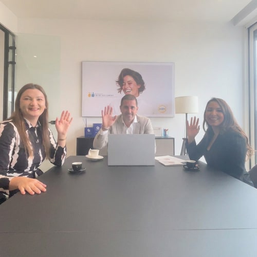 AI Design for A group of people on the photo smiling and waving naturally. Their hands and arms have normal, natural proportions. No distortions, no exaggerated body parts, no surreal or artificial effects — just a lifelike, joyful moment of people smiling and waving. just they look at camera, smile and wave,and thats it