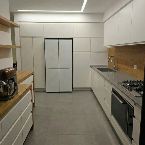 AI Design for Edit the kitchen image so the wood-tone cabinets are changed to match the exact cabinet color and finish shown in the second reference image. Additionally, replace the ceramic wall tiles currently shown with the wood-tone cabinets so they match the color, style, and shape of the tiles used on the opposite side of the cabinets. Ensure the design remains cohesive, balanced, and photorealistic, with consistent lighting and proportions.”