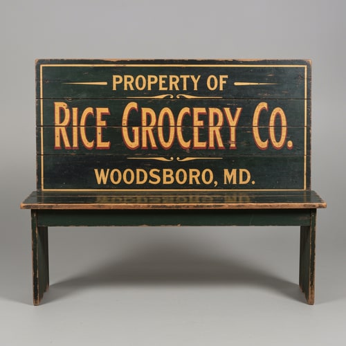 AI Design for A vintage wooden bench designed as an old general store advertising sign, perfectly front-facing (orthographic view, no perspective distortion). The bench looks symmetrical and centered. The top panel is clearly visible like a flat sign. Hand-painted vintage typography reads: “PROPERTY OF” (small, top), “RICE GROCERY CO.” (large, bold centerpiece in warm yellow/orange with red shading), and “WOODSBORO, MD.” (smaller below). The wood is aged and slightly worn with visible grain and distressed paint. Colors include dark green, black, and rustic tones. The bench legs are simple and visible beneath. Studio lighting, neutral background, highly detailed, realistic texture, no angle, straight-on view.
A vintage wooden bench designed like an old general store advertising sign, viewed straight from the front (perfect frontal view, no perspective distortion). The top surface is flat and clearly visible like a signboard. It has hand-painted, slightly worn lettering in a classic 19th-century style. The main text reads “Rice Grocery Co.” in large, bold, warm yellow and red lettering. Above it in smaller text: “Property of”. Below it: “Woodsboro, MD.” The wood is aged, slightly weathered with visible grain and subtle paint wear. Colors are dark green, black, and rustic tones. The bench has simple wooden legs visible underneath. Lighting is soft and natural, background neutral and unobtrusive.
