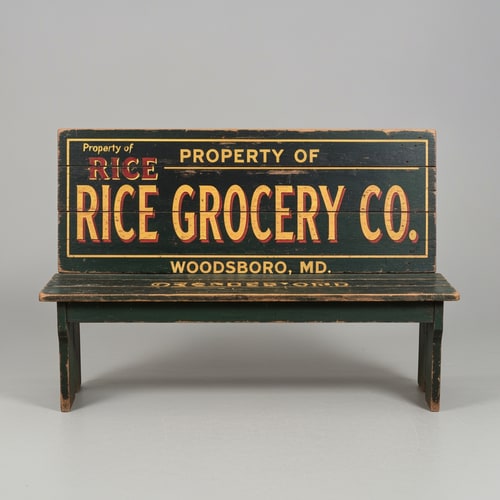 AI Design for A vintage wooden bench designed as an old general store advertising sign, perfectly front-facing (orthographic view, no perspective distortion). The bench looks symmetrical and centered. The top panel is clearly visible like a flat sign. Hand-painted vintage typography reads: “PROPERTY OF” (small, top), “RICE GROCERY CO.” (large, bold centerpiece in warm yellow/orange with red shading), and “WOODSBORO, MD.” (smaller below). The wood is aged and slightly worn with visible grain and distressed paint. Colors include dark green, black, and rustic tones. The bench legs are simple and visible beneath. Studio lighting, neutral background, highly detailed, realistic texture, no angle, straight-on view.
A vintage wooden bench designed like an old general store advertising sign, viewed straight from the front (perfect frontal view, no perspective distortion). The top surface is flat and clearly visible like a signboard. It has hand-painted, slightly worn lettering in a classic 19th-century style. The main text reads “Rice Grocery Co.” in large, bold, warm yellow and red lettering. Above it in smaller text: “Property of”. Below it: “Woodsboro, MD.” The wood is aged, slightly weathered with visible grain and subtle paint wear. Colors are dark green, black, and rustic tones. The bench has simple wooden legs visible underneath. Lighting is soft and natural, background neutral and unobtrusive.
