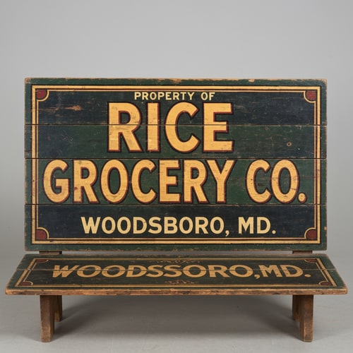 AI Design for A vintage wooden bench designed like an old general store advertising sign, viewed straight from the front (perfect frontal view, no perspective distortion). The top surface is flat and clearly visible like a signboard. It has hand-painted, slightly worn lettering in a classic 19th-century style. The main text reads “Rice Grocery Co.” in large, bold, warm yellow and red lettering. Above it in smaller text: “Property of”. Below it: “Woodsboro, MD.” The wood is aged, slightly weathered with visible grain and subtle paint wear. Colors are dark green, black, and rustic tones. The bench has simple wooden legs visible underneath. Lighting is soft and natural, background neutral and unobtrusive.
