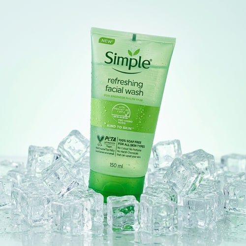 AI Design for Simple Refreshing Facial Wash placed on top of crystal-clear ice cubes with condensation droplets forming naturally, soft cool-toned lighting, minimal white and mint background, fresh hydration mood, subtle reflections on ice surface, luxury skincare product photography style, ultra-clean composition