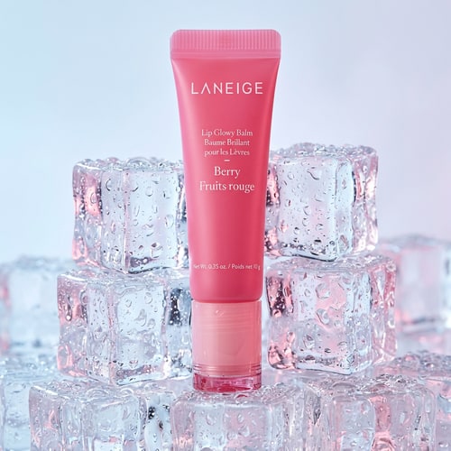 AI Design for Use the exact product image of Laneige Lip Glowy Balm Berry. Do not change packaging, logo, or color. Maintain original branding and text clarity. High-end luxury beauty campaign, soft studio lighting, ultra-realistic, macro photography, shallow depth of field.”Place the Laneige Lip Glowy Balm Berry on clear ice cubes with condensation droplets. Cool-toned lighting with pink reflections, fresh and hydrating feel, minimal luxury aesthetic.”