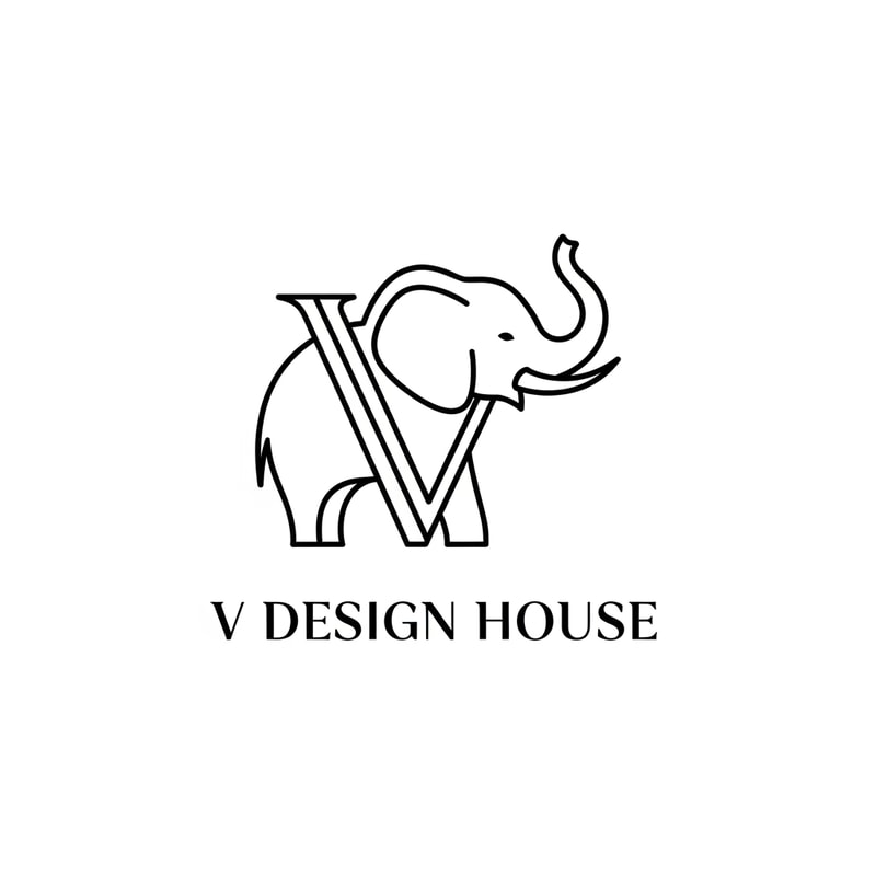 A stylized elephant outline forming the letter “V”
A stylized elephant outline forming the letter “V”

Thin, elegant lines

Elephant trunk curved upward (symbol of luck & prosperity)

Text below:

V Design House

Font style: Modern serif (luxury look)
Thin, elegant lines



Text below:

V Design House

Font style: Modern serif (luxury look)