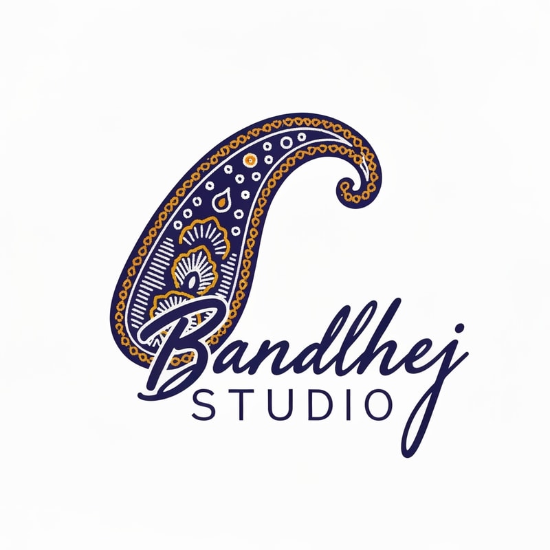 Professional logo design. Minimalist logo for a sari design company named "Bandhej Studio": Abstract representation of a paisley motif in a fluid, flowing form, symbolizing the drape of a sari and the intricate patterns of bandhej art. Color palette: Deep indigo, saffron yellow, and ivory white, evoking traditional Indian textiles and natural dyes. Typography: Elegant, hand-drawn script for "Bandhej Studio," with a slightly more modern sans-serif for "Studio." Design with an influence of traditional Indian block printing and contemporary art. Visual execution: Clean lines, subtle gradients, and a sense of organic movement. Background type: Clean white.