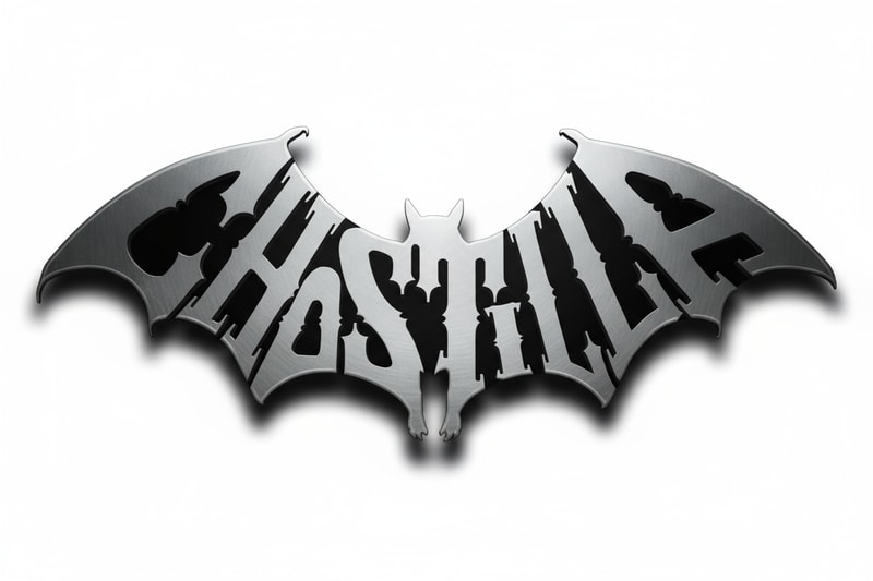 “A metallic bat-shaped emblem with the word CHOSTILLA integrated into its wings and body. The letters are embossed and raised, forming a cohesive 3D structure. The surface is brushed titanium or polished silver, with dramatic lighting from the top left. The background is transparent. Gothic style, sharp edges, symmetrical wings, cinematic logo design.”