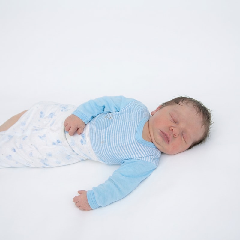 ehance the quality of photo. remove background of the baby