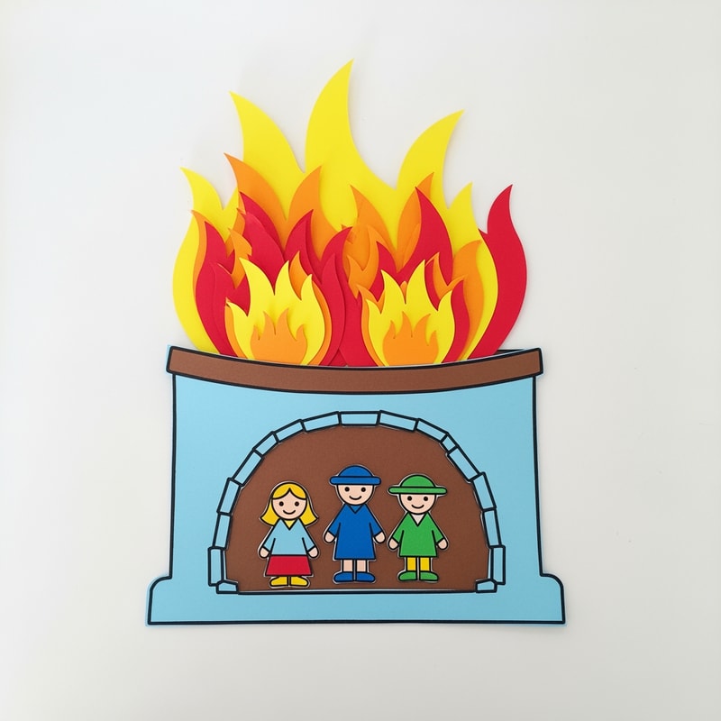 A simple, fully assembled construction paper craft project depicting three small figures standing unharmed inside a tall, stylized fiery furnace structure, designed as an example for a children’s Bible story activity — Close-up flat lay composition with a slight overhead view, optimizing for instructional clarity of the assembled pieces; Centered focus on the furnace craft; Bright, highly saturated primary colors emphasizing yellows, reds, and orange for the fire against light blue and brown for the structure; Clean, bright, even studio lighting creating a joyful and safe educational mood; Simplified paper craft style with bold outlines and flat graphic shapes, visibly constructed from cut cardstock or felt; Must appear as a tangible, simple children's craft project suitable for primary students; avoid realism, avoid complex shadows, and ensure the fire looks stylized and safe; Clean white desktop surface.
