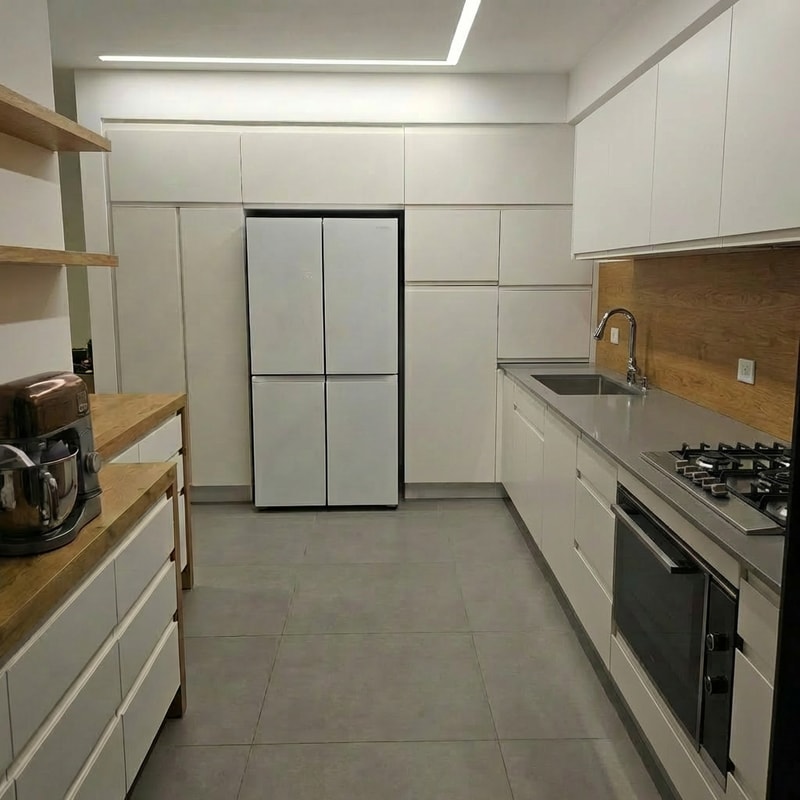 Edit the kitchen image so the wood-tone cabinets are changed to match the exact cabinet color and finish shown in the second reference image. Additionally, replace the ceramic wall tiles currently shown with the wood-tone cabinets so they match the color, style, and shape of the tiles used on the opposite side of the cabinets. Ensure the design remains cohesive, balanced, and photorealistic, with consistent lighting and proportions.”